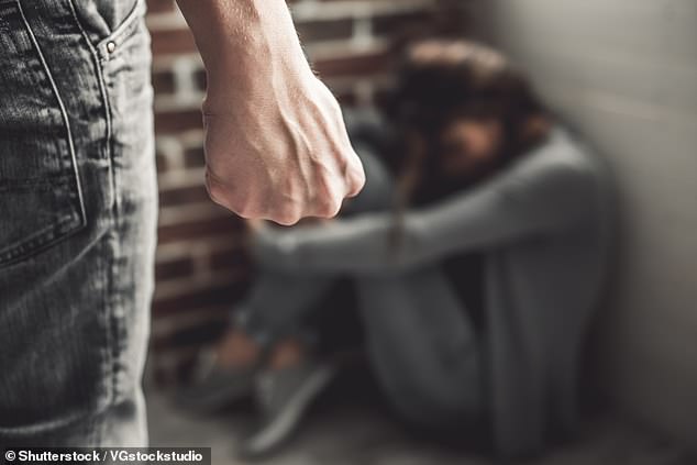 A man convicted of domestic violence (stock image) and another convicted of human trafficking are free in the public after being released from indefinite detention