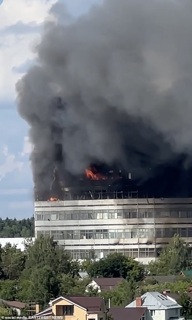 Black smoke rises into the air above the high-rise building in Fryazino, near Moscow
