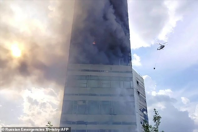 Firefighters are extinguishing a huge fire in a high-rise building in the city of Fryazino in the Moscow region