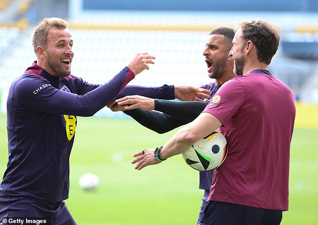Gareth Southgate, right, acted as a referee for several games of head tennis in training