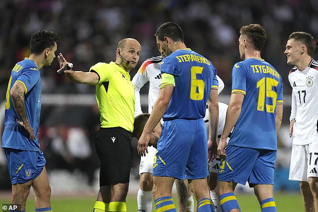 UEFA is trying to curb incidents of players around a referee after a decision