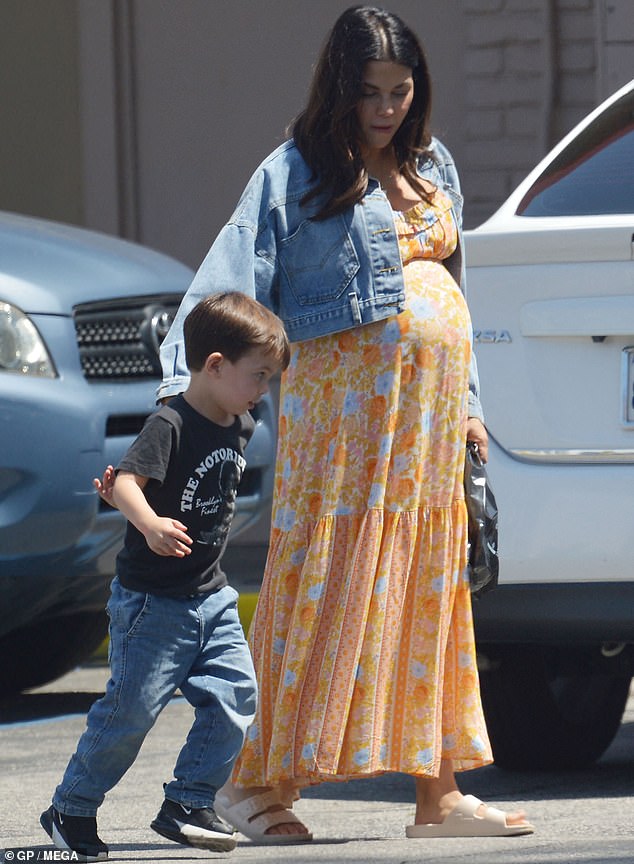 Jenna Dewan draped her blossoming baby bump in a floral maternity dress while out with her son Callum, four, in Los Angeles this week