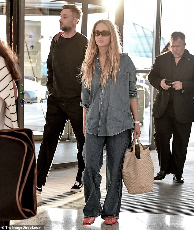 Jennifer Lawrence was joined by her husband, Cooke Maroney, as she arrived at JFK Airport in New York City on Saturday morning