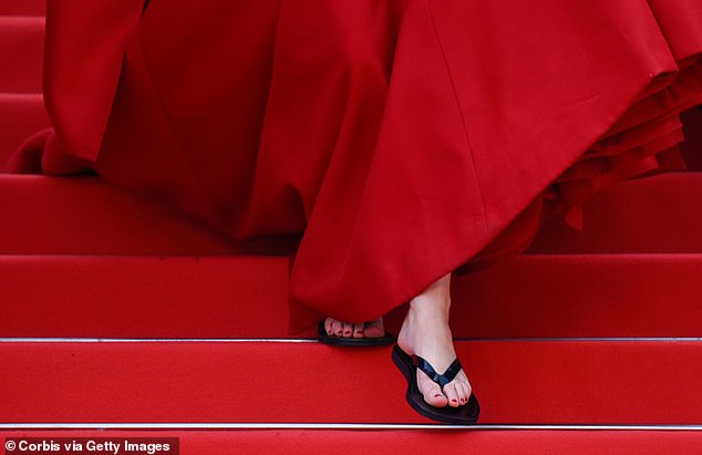 Lawrence previously swapped the heels for a pair of slides while attending the Anatomy Of A Fall premiere at the 2023 Cannes Film Festival