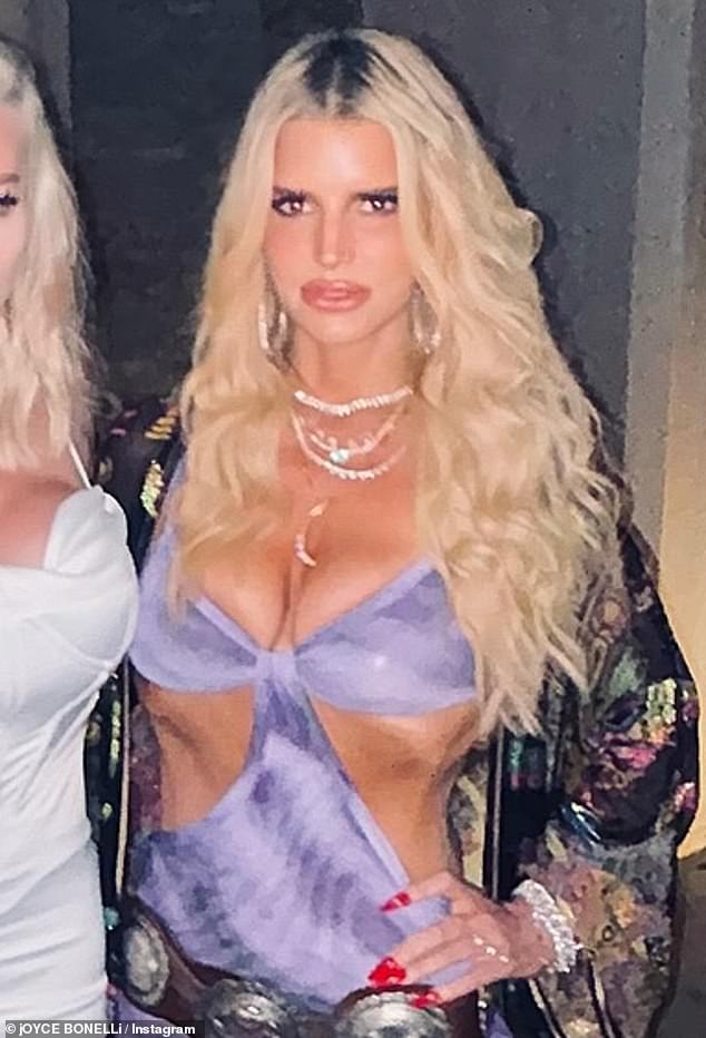 Jessica Simpson, 43, put on a busy performance at Nobu Cabos on Wednesday night.  The former reality TV siren wore a light purple dress that was not only low-cut, but also had cutouts on the sides of her stomach