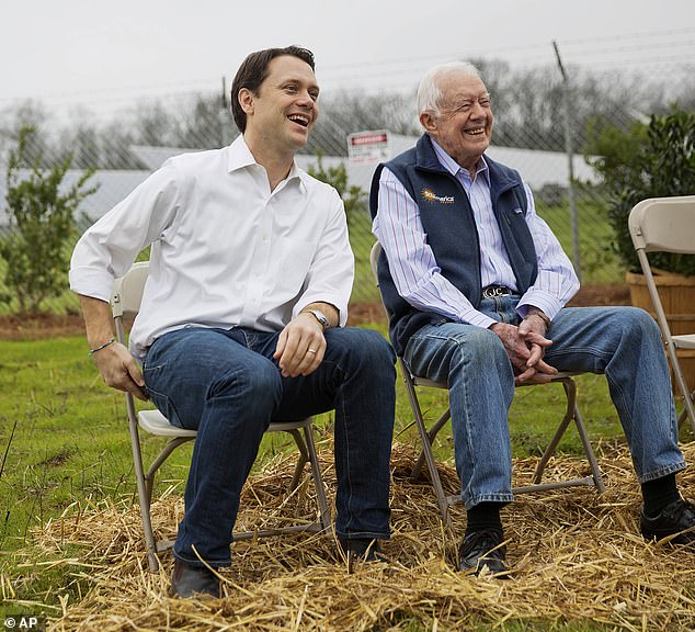 Jimmy Carter's eldest grandchild Jason (left) revealed the 99-year-old former president is no longer awake every day after 16 months in a hospice at home