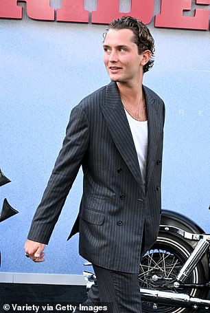 Rafferty Law (pictured) bore a striking resemblance to his famous father Jude at the premiere of The Bikeriders in Los Angeles on Monday night