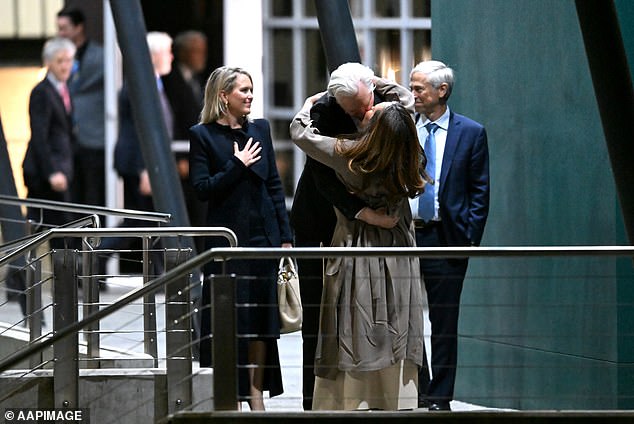 Julian Assange and his wife Stella embrace after he landed in Canberra around 7.30pm on Wednesday (pictured)