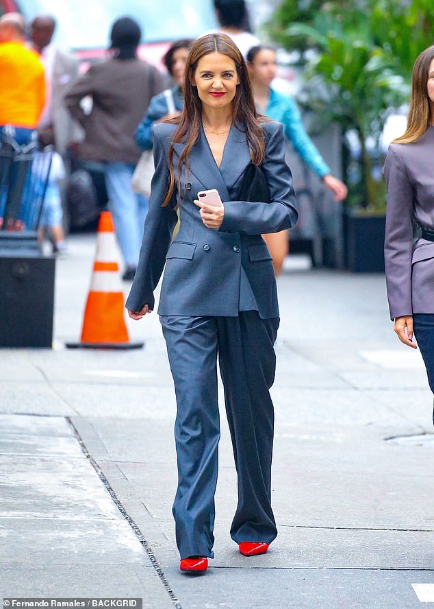 Katie Holmes was the epitome of chic in a stylish navy blue suit as she enjoyed a stroll through Soho in New York on Tuesday