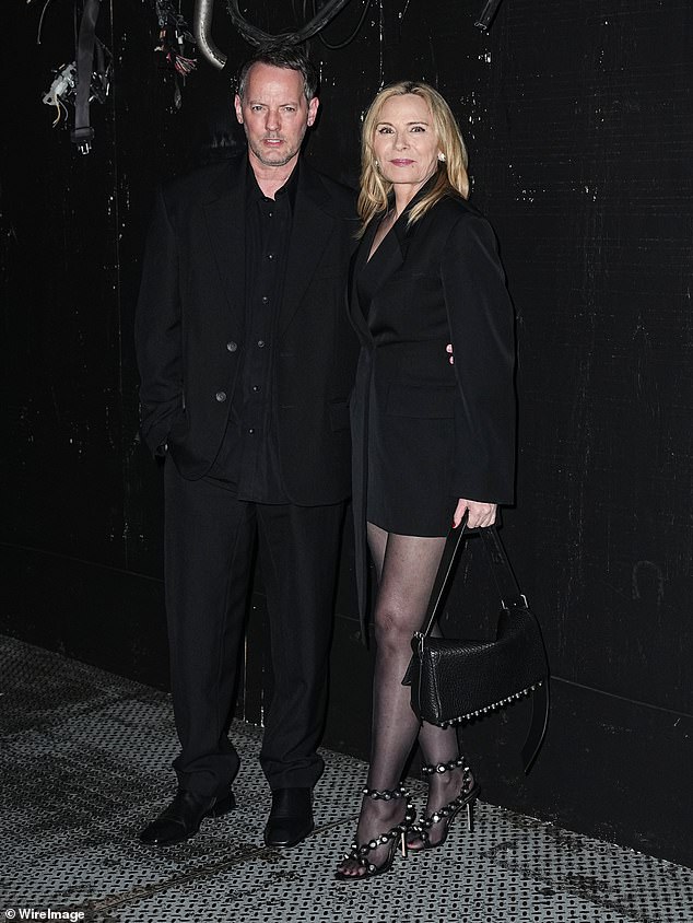 Kim Cattrall made the rare move of posing with her boyfriend Russell Thomas at the Alexander Wang runway show in New York City on Wednesday