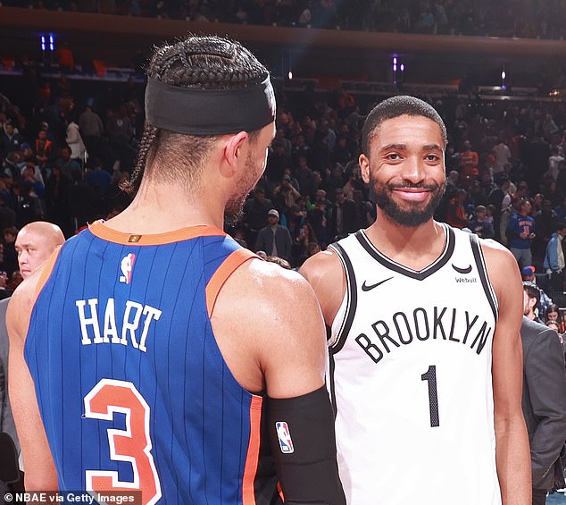 Mikal Bridges smiles at ex-Villanova teammate Josh Hart after a Nets-Knicks game in March