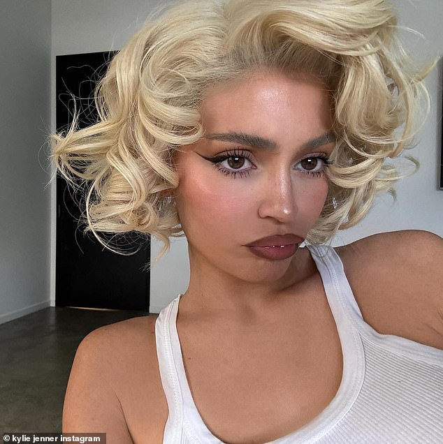 The Kylie Cosmetics founder wore a plain white tank top and eschewed jewelry for the photos.  