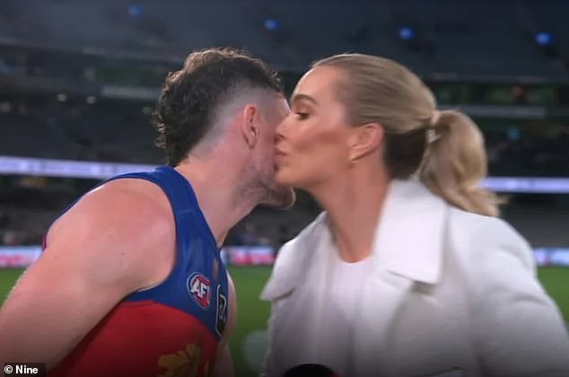 Neale and Holmes shared this innocent kiss after a television interview and it has since gone viral