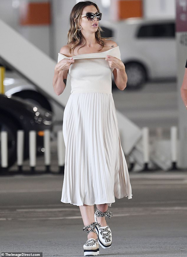 Lala Kent draped her baby bump in a summery white maternity dress as she showed up in Los Angeles this week ahead of the arrival of her second daughter
