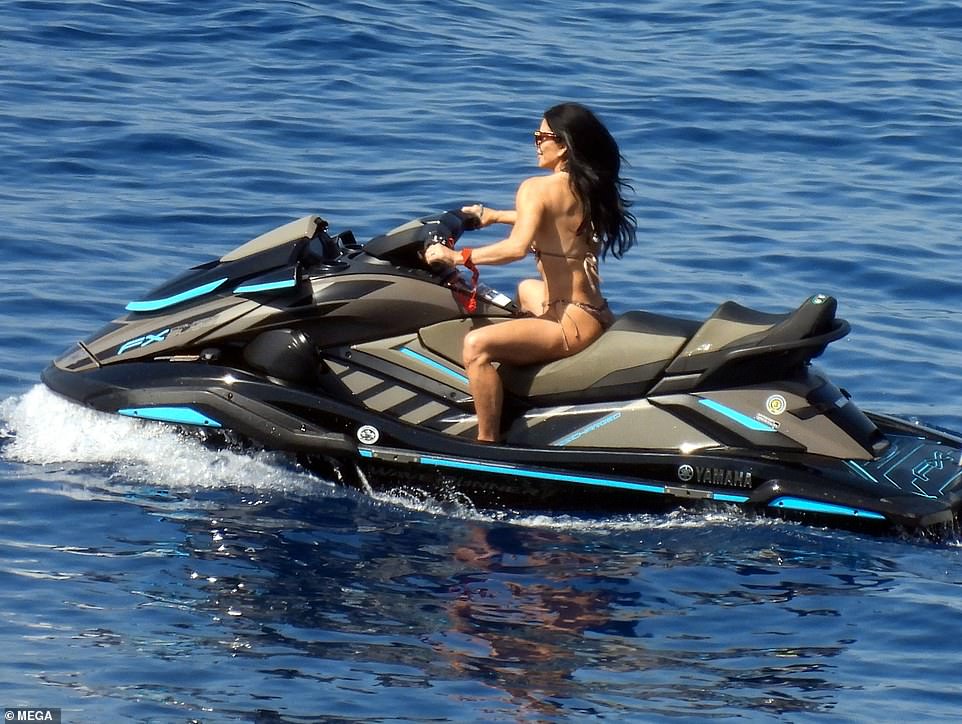 Lauren Sanchez looked every inch an action hero as she rode majestically over the waves on a jet ski in Greece