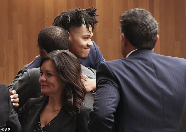 Terrence Shannon Jr., center, receives a hug after being found innocent Thursday in Kansas