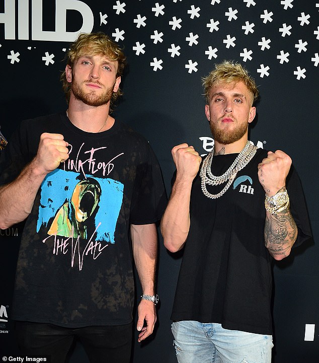 Logan Paul (L) has offered to replace Mike Tyson and fight his brother Jake Paul (R).