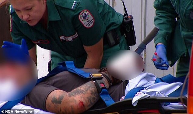 A man has been taken to hospital with a knife in his hand after an alleged assault in his home