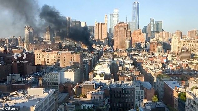 A massive fire has ripped through a luxury Soho building, sending huge plumes of smoke into the New York City skyline