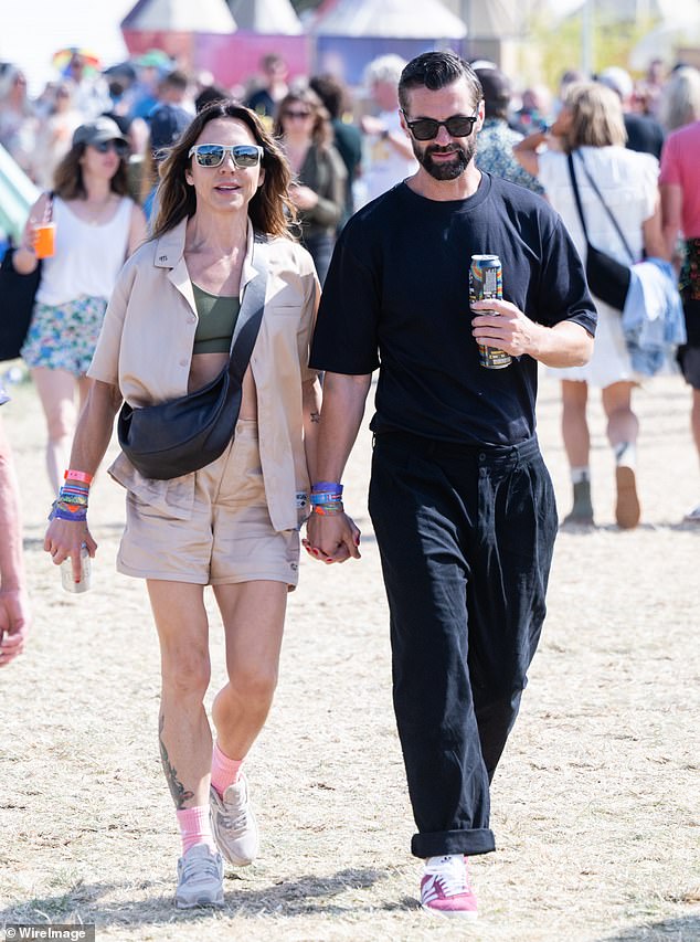 Mel C announced her new mystery man on Saturday as the pair walked hand-in-hand around the Glastonbury Festival.  Both shown