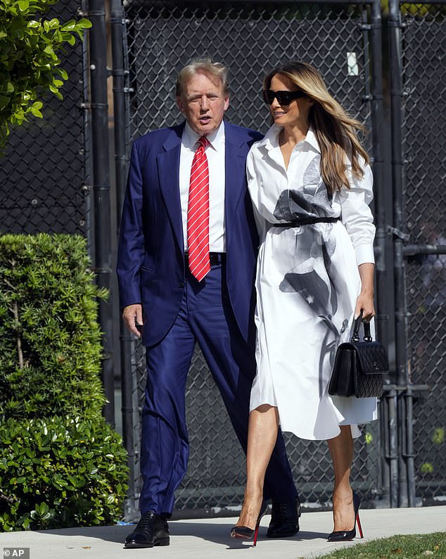 Melania Trump smiles as she accompanies the ex-president to vote during the Florida Republican presidential primaries in Palm Beach, Florida, on March 19.  When asked about campaigns, she said 'stay tuned'