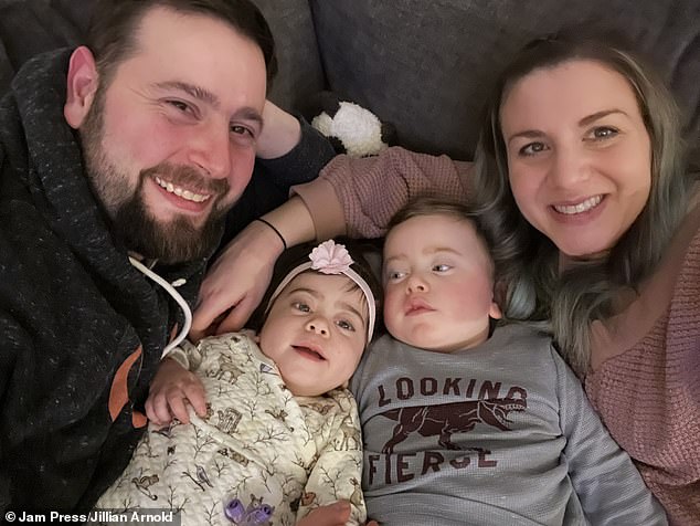 Stella (center left) and Roman Arnold (center right) have a rare genetic condition that causes progressive neurological decline, similar to Alzheimer's disease in adults.  They are pictured with their parents Donald (far left) and Jillian (far right)