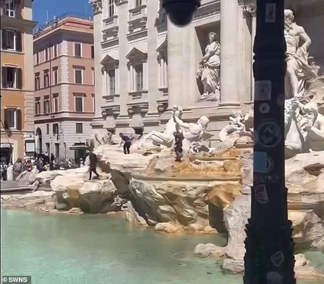 After walking back and forth over the cascading waterfall built into the fountain, you can see him dipping his hands and head into the flowing water.