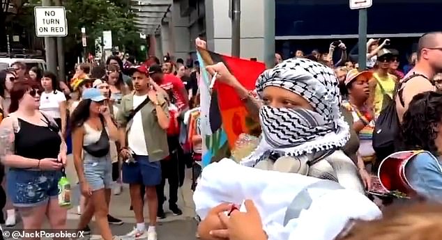 Some wore keffiyehs, others wore leather belts and vests, the pro-Palestinian crowd stopped the parade route to shout and shout at members of their own community