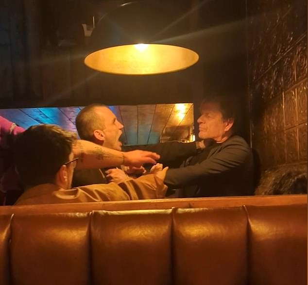 The actor was seen with his hand around his throat as he struggled with security at the Tom Thumb pub in Liverpool on Friday, May 31.