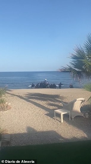 About 30 migrants reach the coast of Almeria on powerful speedboats as bewildered locals and tourists look on.