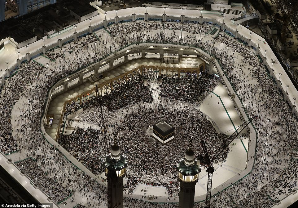 An aerial view shows Muslims coming from all over the world to the holy land continue their prayers to fulfill the Hajj pilgrimage as they walk around and pray at the Kaaba in Mecca, Saudi Arabia