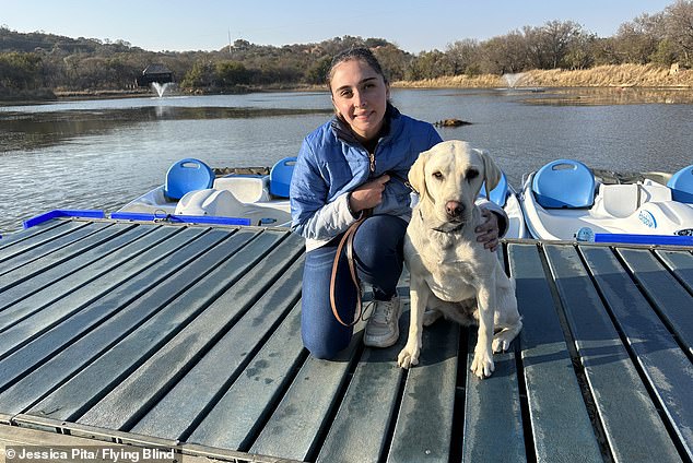 Jessica Pita lost her sight when she was just 11 years old, but she didn't let her disability hold her back - she is now a certified diver.  She is pictured here with her guide dog, Fudge