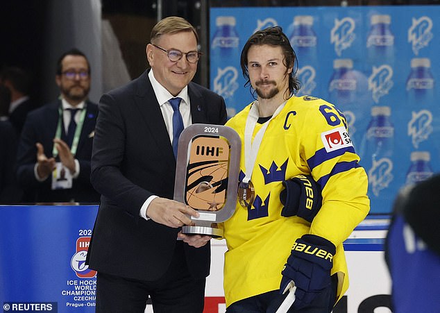 Ice hockey star Erik Karlsson (R) has confirmed his investment in League One side Burton Albion