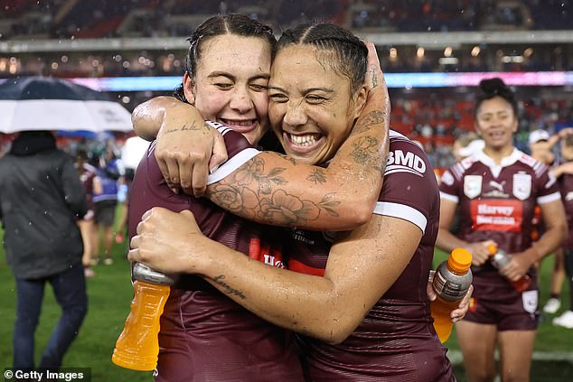 The Maroons' Jessika Elliston and Shannon Mato celebrate winning game two of the Women's State of Origin series