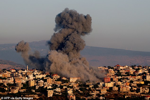 Black smoke rises after an Israeli airstrike on a house in the southern Lebanese village of Khiam, near the Lebanese-Israeli border, on June 21, 2024