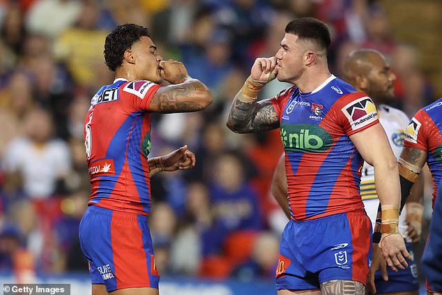 Will Pryce (pictured left) of the Knights celebrates his goal against the Eels on his debut