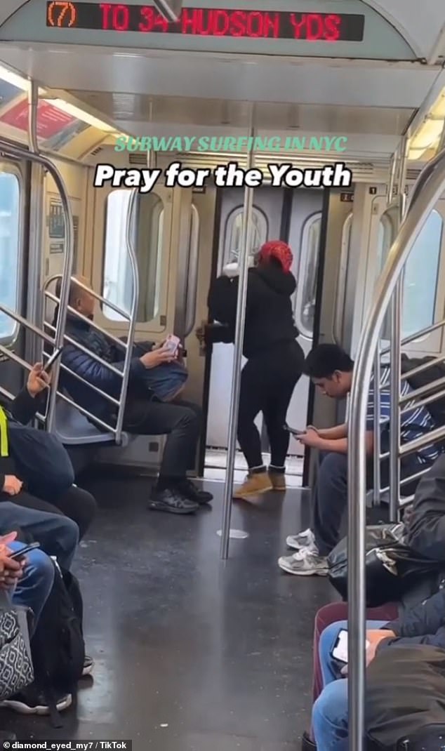 A woman has a hilarious reaction when she realizes someone is surfing on top of her subway