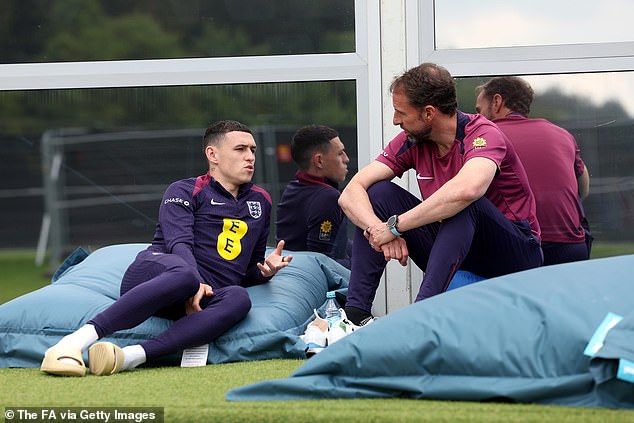 Gareth Southgate (right) claims England are not listening to outside noise, despite fierce criticism of his players, including Phil Foden (left)
