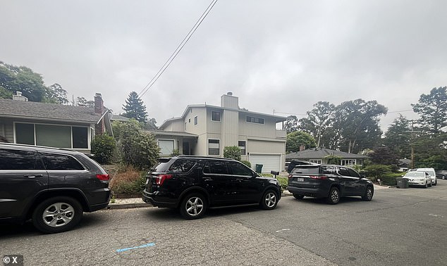 A photo was seen of her home on Maiden Lane surrounded by several unmarked, black vehicles parked on the street