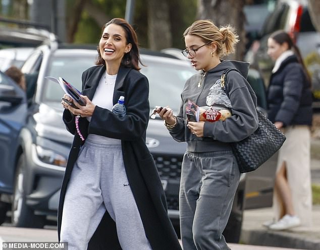 The mother-daughter duo both wore gray tracksuit bottoms as they walked around Melbourne on Wednesday