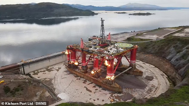 Demolition charges ignite in the legs of the oil rig while it is in the huge dry dock on Loch Kishorn