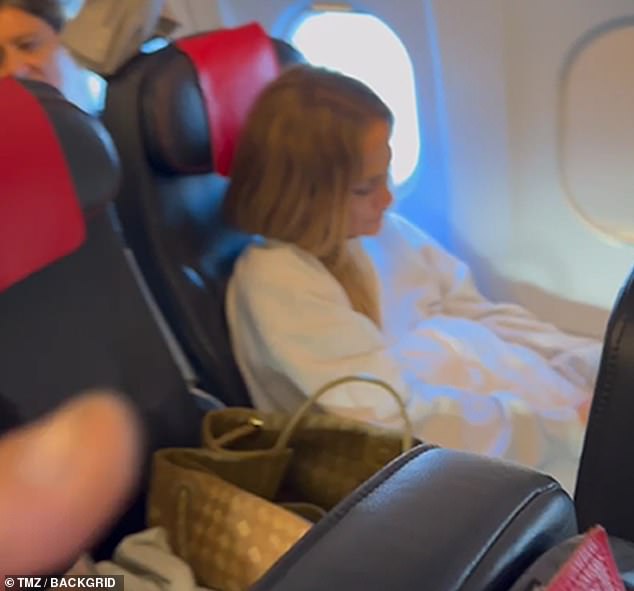 Jennifer Lopez tried her best not to draw attention to herself as she was spotted flying in economy on a KLM flight from Naples, Italy to Paris, France this weekend