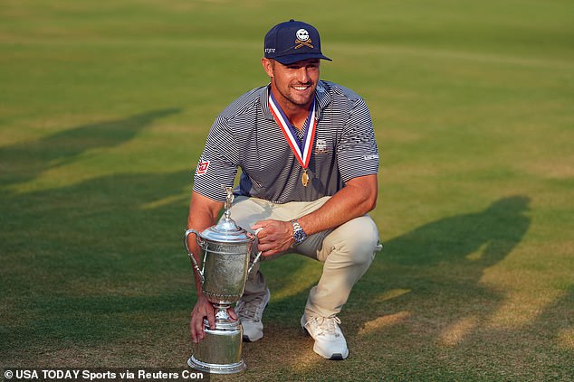 Bryson DeChambeau poses with the trophy after dramatic victory at the US Open