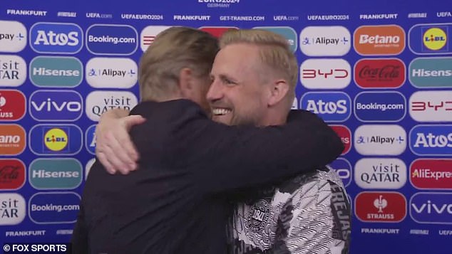 Peter (left) and Kasper (right) Schmeichel shared a hug on TV after a short interview