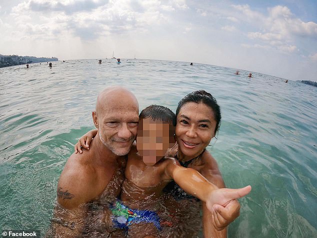 James Everett du Bois, 49, went swimming with his Thai wife, Siriarmorn Phetarwut, 49, and their son Boonpat, three, at Nai Harn Beach in Phuket, Thailand on Sunday afternoon (photo: the family on a previous beach trip)