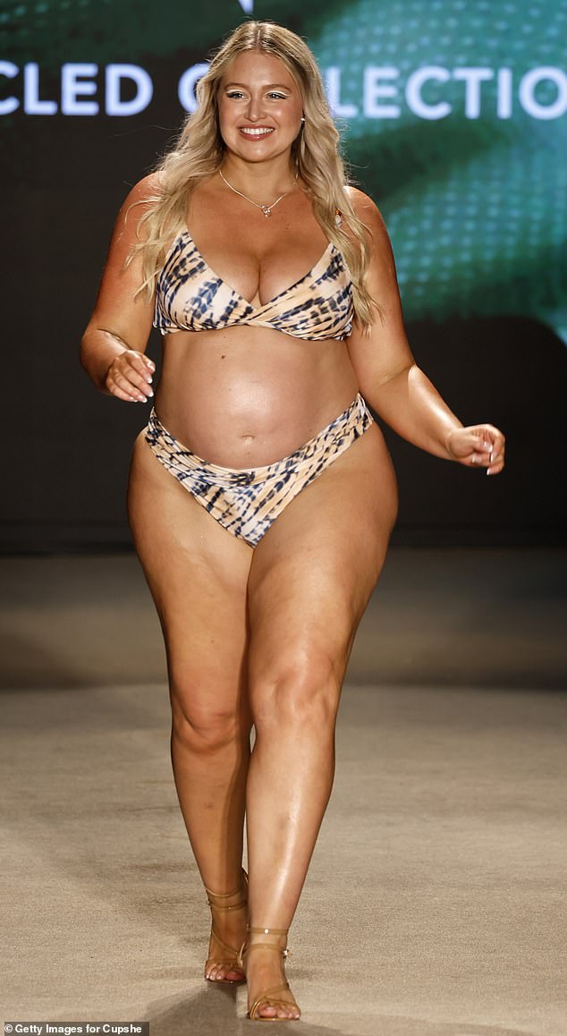 Pregnant Iskra Lawrence proudly showed off her baby bump as she walked a fashion show during Paraiso Miami Swim Week at the Paraiso Tent in Miami on Sunday