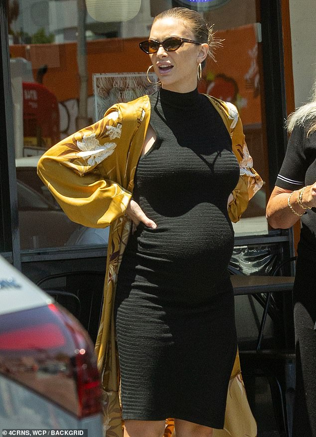 Lala Kent showed off her baby bump in a chic sleeveless black turtleneck dress for a lunch outing Thursday in Sherman Oaks, California with 3-year-old daughter Ocean and mom Lisa Burningham