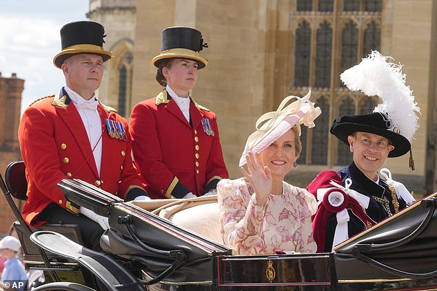 Sophie, Duchess of Edinburgh, and her husband Prince Edward wave to the crowd after the service