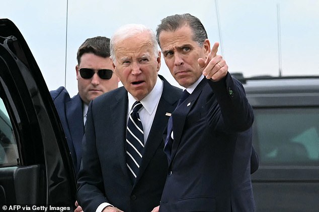 U.S. President Joe Biden talks with his son Hunter Biden at the Delaware Air National Guard Base in New Castle, Delaware, on June 11, 2024, following Hunter's conviction for a firearms trial