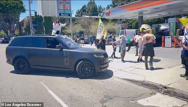 A pro-Palestinian protester threw counter-protesters from the sunroof of her Range Rover outside a Los Angeles gas station